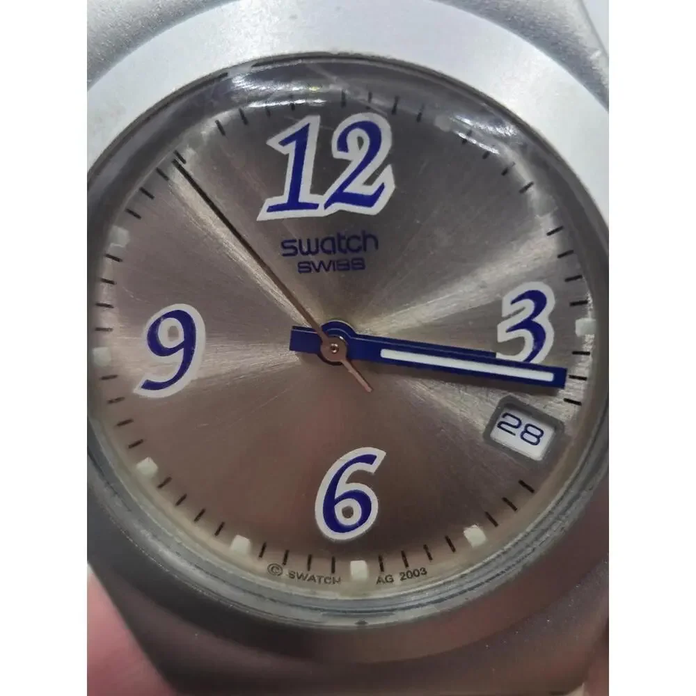 Swatch Women's Silver Case White Strap Watch with Blue Accents